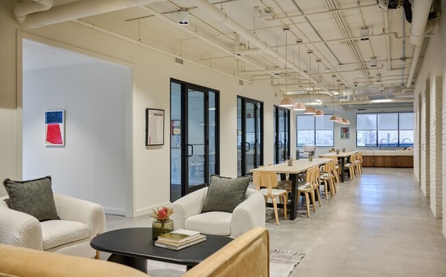 Community co-working area with private meeting rooms and offices