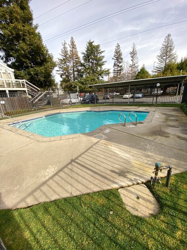 Photo - Bright Vaulted-Ceiling Condo in Gated Community • Pool • W/D Included • Move-In Ready