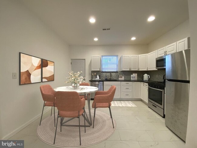 Photo - Updated 2-Bedroom Home with Finished Basement and Private Yard Near University City