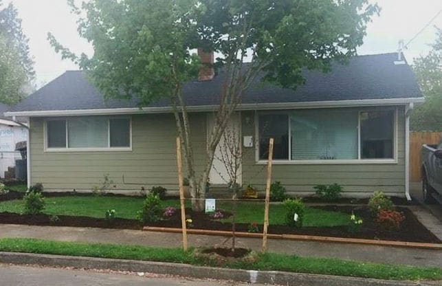 New siding and flowering landscape - 9313 North Hodge Avenue