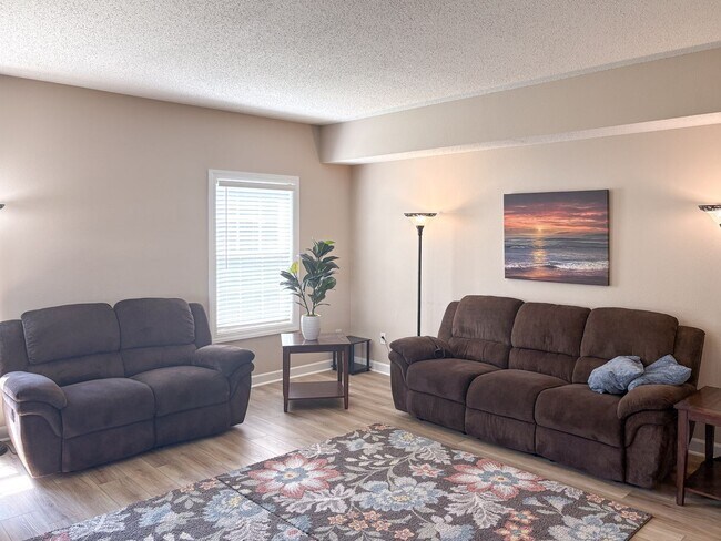 Photo - Fully Furnished 4-Bedroom Home with a Stocked Kitchen, Fenced Yard, and 2-Car Garage