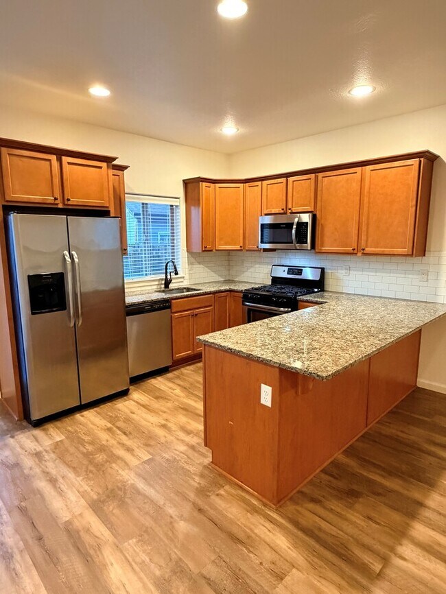 Photo - Beautiful Home w/Gas Fireplace, Plank Flooring, Fenced Yard, Garage, W/D & MORE!