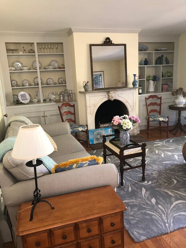 Living room, lighted built in shelving beside fireplace - 21 Usher Ter