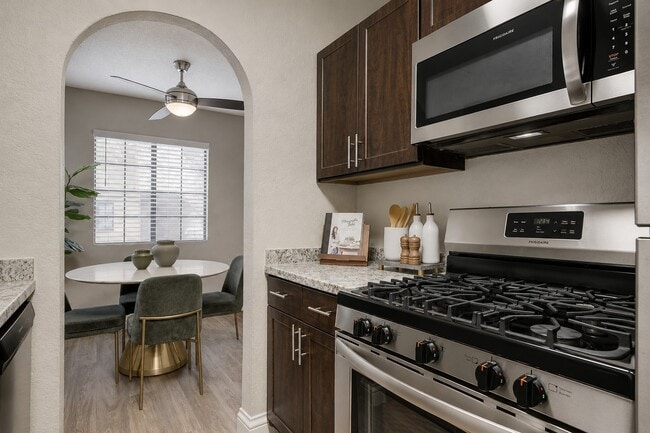 Elevate your lifestyle at Spanish Wells with this modern kitchen featuring stainless steel appliances and chic finishes. Thoughtfully designed for both cooking and entertaining, it’s perfect for creating memorable moments. Schedule a tour today!