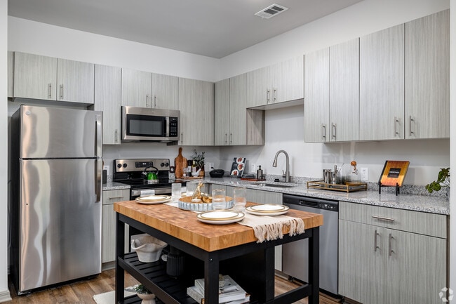 1BR, 1BA - 829SF - Kitchen with Island - Sweetwater Vista