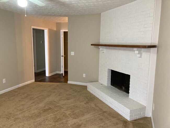 Family room with fireplace - 725 Bellemeade Way SW Unit A