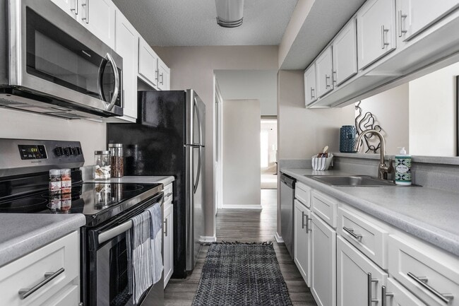 Kitchen with Stainless Steel Appliances - Stonebridge Crossing Apartments
