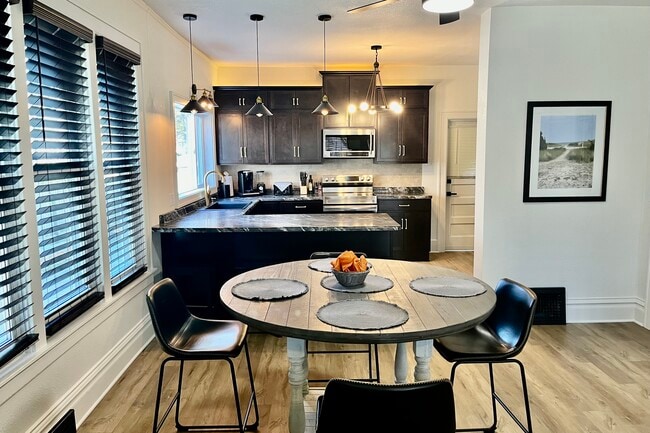 Main level dining area with view of kitchen
