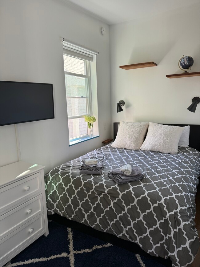 Queen bed and tv