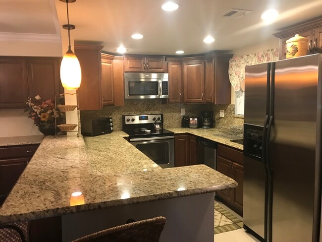 granite kitchen w/bar stools - 135 Deer Creek Blvd Unit 302