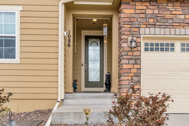 Photo - Beautiful low-maintenance ranch home with turf in front and back!