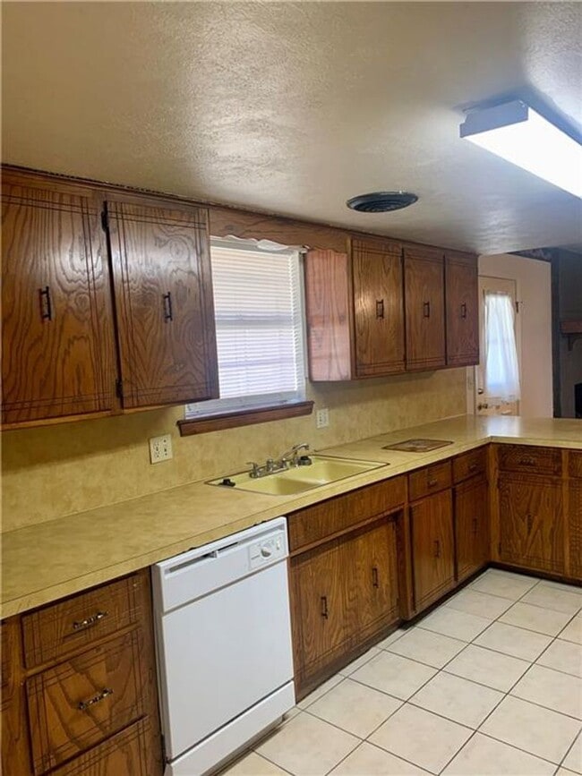 Photo - Charming Home with Open Kitchen, Fireplace & 2-Car Garage