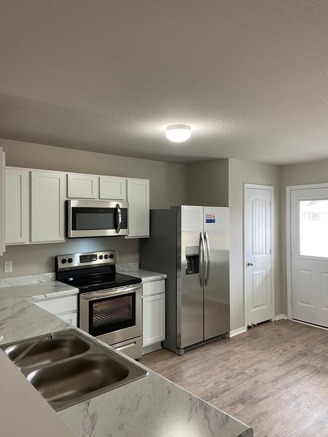 Photo - Now Pre-Leasing — Spacious 4 Bedroom, 2 Bath Home in Conrad Court