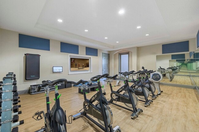Fitness studio with on-demand virtual trainer and spin bikes