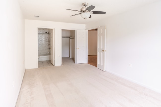 Bedroom with bathroom and walk in closet