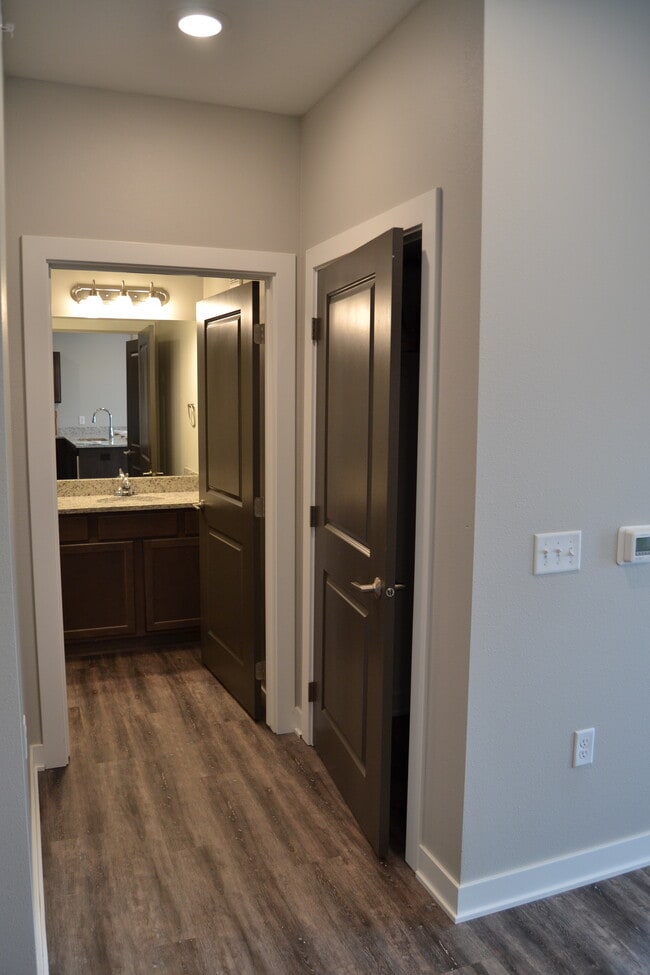 Hall Closet + Bath 1 - Perrywood Apartments
