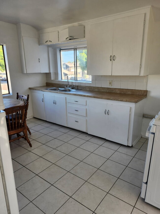 Kitchen with stove and refrigeratorfrig - 2465 250th St Unit 2465