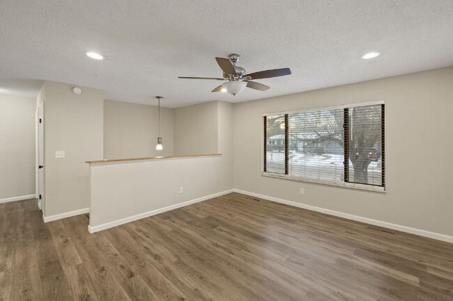 Photo - Spacious Split-Level Home with Finished Basement, Deck, Fenced Yard & 2-Car Garage