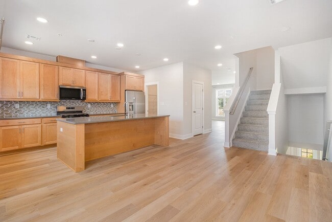 Building Photo - Modern 2025 Townhome | Open-Concept Living, Chef’s Kitchen with Large Island & 2-Car Garage