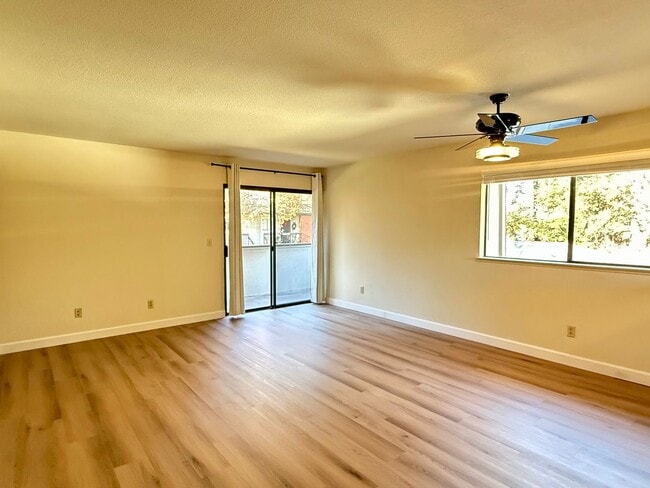 Photo - New Vinyl Plank Flooring, Fresh Interior Paint, 1 Car Garage + 1 Assigned Outdoor Parking Space -...
