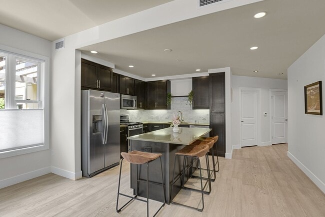 Building Photo - Modern First-Floor Condo at the Peloton - ...