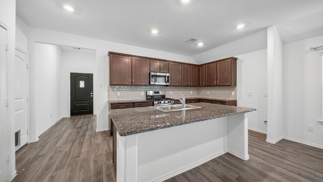 Photo - Welcome to this beautifully maintained one-story home offering 4 bedrooms, 2.5 bathrooms, and a s...