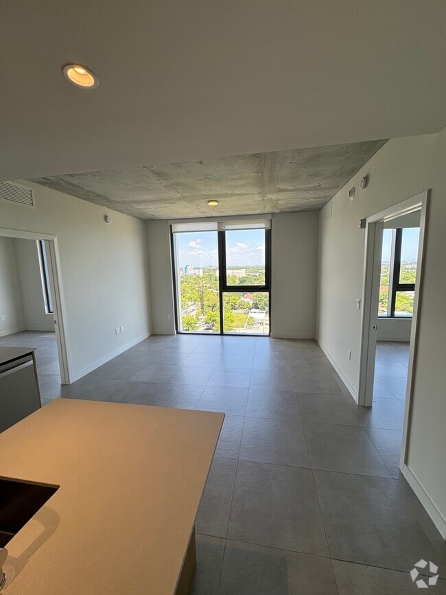 Living Room Floor to Ceiling Windows - 138 NW 31st St Unit C2 Rental