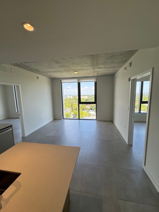 Living Room Floor to Ceiling Windows - 138 NW 31st St Unit C2 Rental