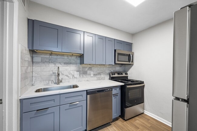 Renovated Kitchens with Quartz Countertops - Dunwoody Glen Apartments