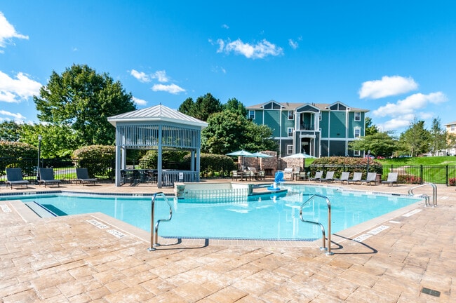 Sparkling Pool and Grill Area - The Pointe at State College Apartments