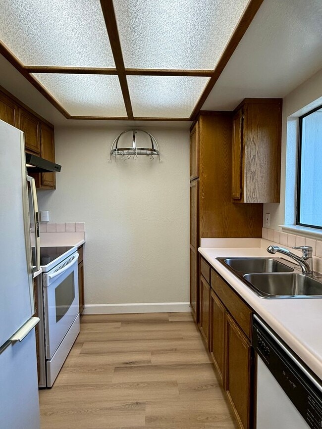 Photo - New Vinyl Plank Flooring, Fresh Interior Paint, 1 Car Garage + 1 Assigned Outdoor Parking Space -...