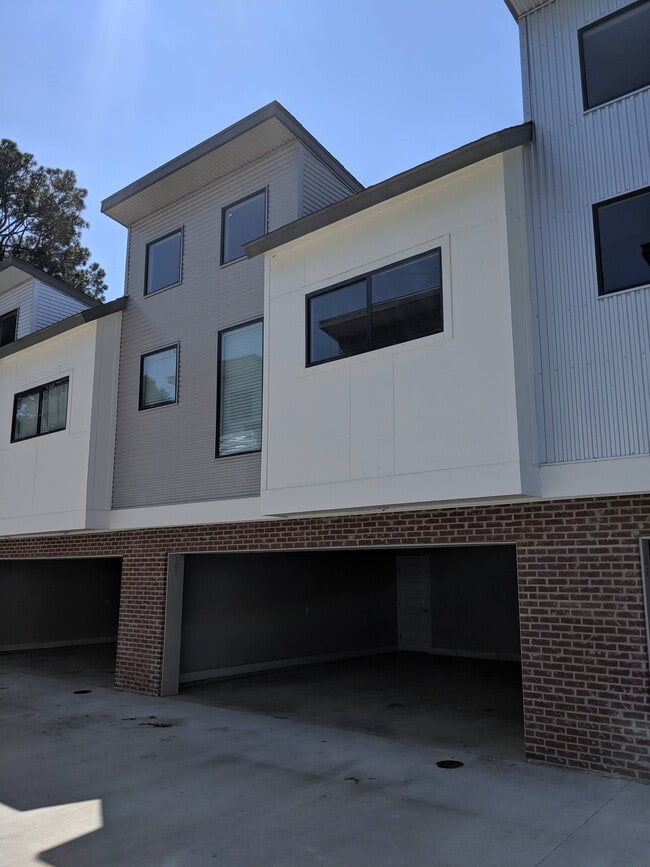 Outside view of complex and carport - 112 Ragin Lofts Aly