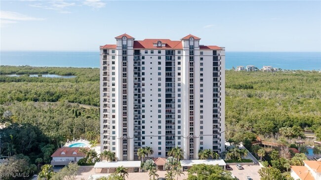 Building Photo - 7225 Pelican Bay Blvd Unit 1504 Rental