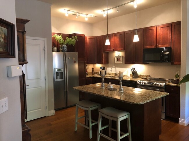 Modern kitchen with stone counters - 200 Poplar St Unit E