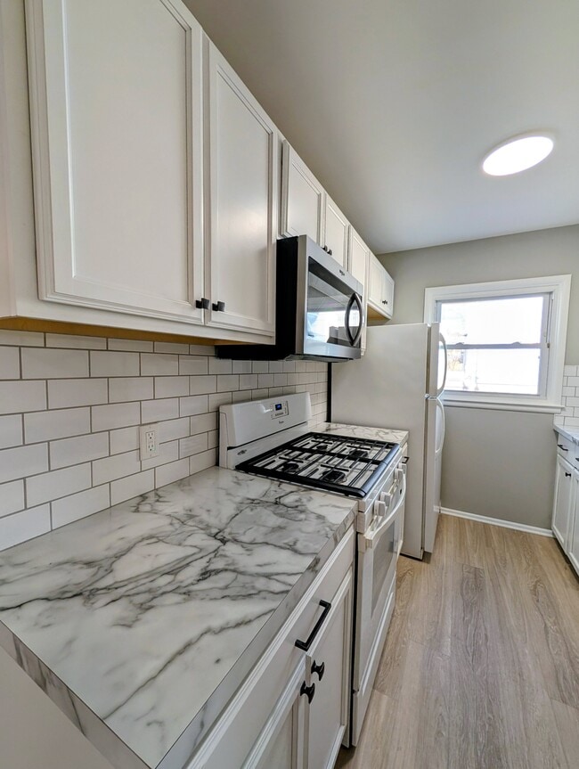 New countertop and backsplash. - 1824 Herrick Ave NE
