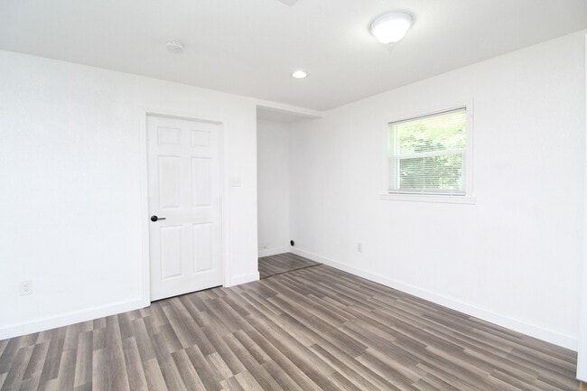 Photo - 4BR Home with LVP Flooring, Open Layout & Large Backyard Near Dogwood