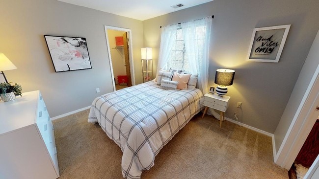 Light-colored walls and open floor space enhance the airy atmosphere, while the natural light highlights the room’s details. - Central Park Place