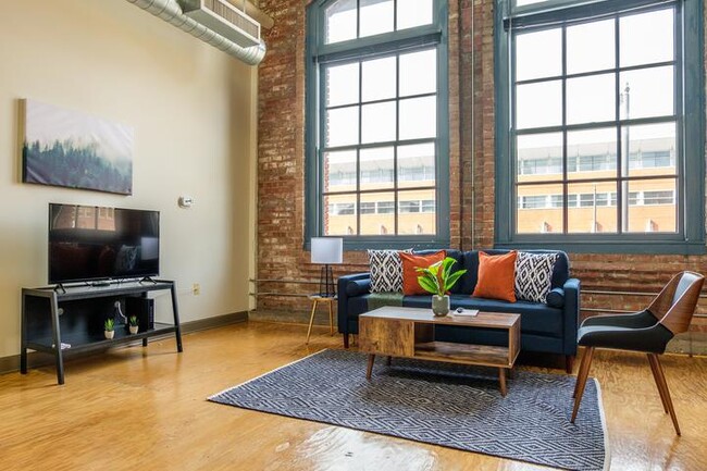 Living room with natural light - Tower Press Building Apartments