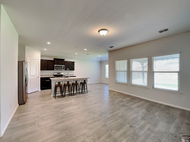 Photo - Chapel Creek Beauty with Designer Kitchen, Spacious Layout & Private Backyard Retreat!