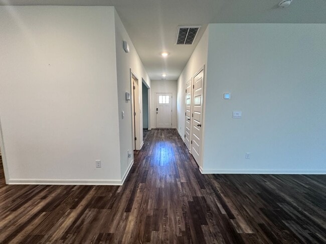 Photo - efficient two-level home provides a large living room, 4 very spacious bedrooms, and 2.5 bathrooms