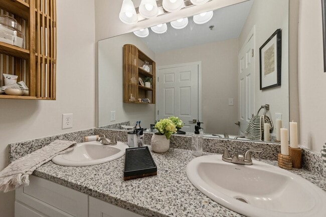 Elegant Bathroom with Double Vanity and Granite Counters