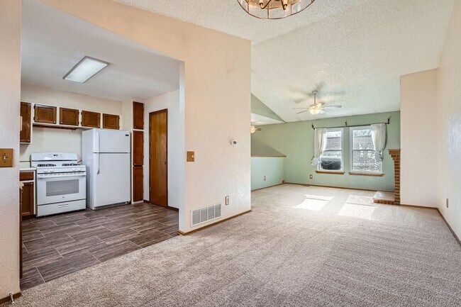 Photo - Spacious 2-Bed Townhome with Private Yard & 2-Car Garage in Aurora