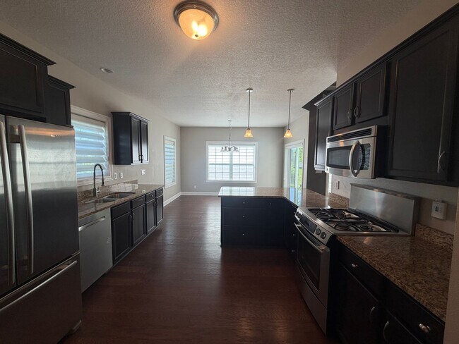 Photo - Beautiful Single Family Home - Attached 3 Car Garage with Fenced-In Backyard