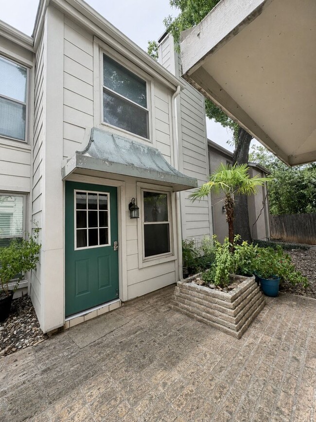 Photo - Single-level living on ground floor  |  Fresh paint (July 2026)  |  2 carports  |  Community Pool...
