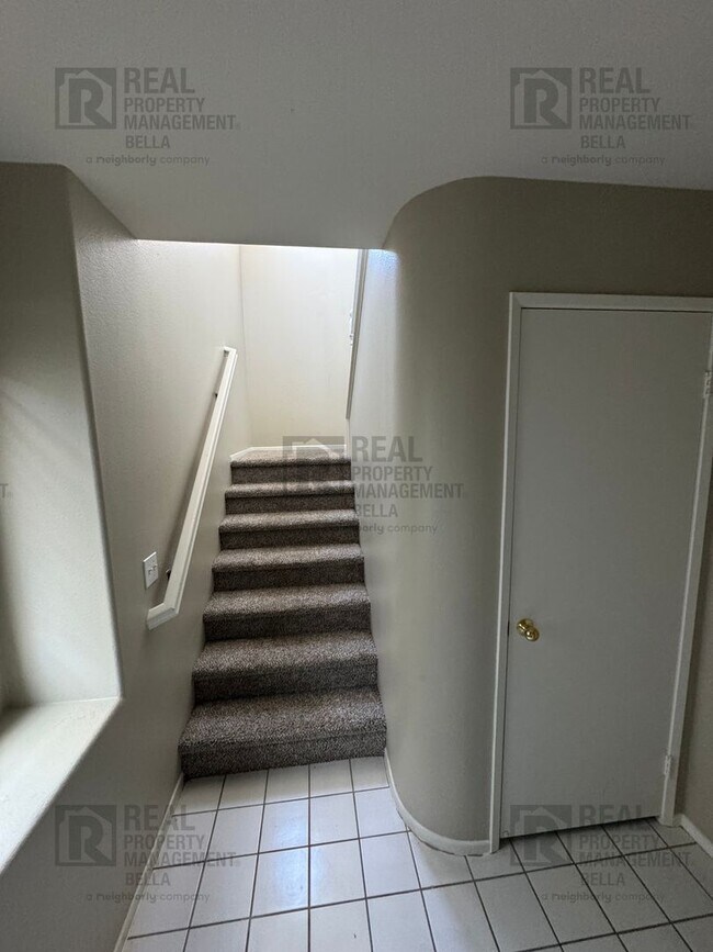 Photo - Charming End-Unit Condo with Modern Amenit...