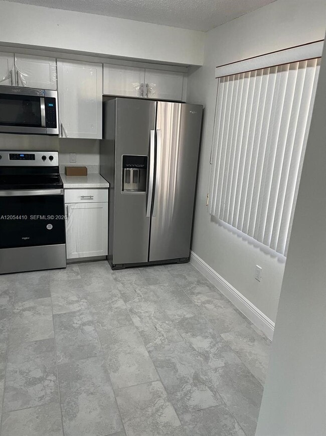 Building Photo - 1351 SW 141st Ave Unit 207G