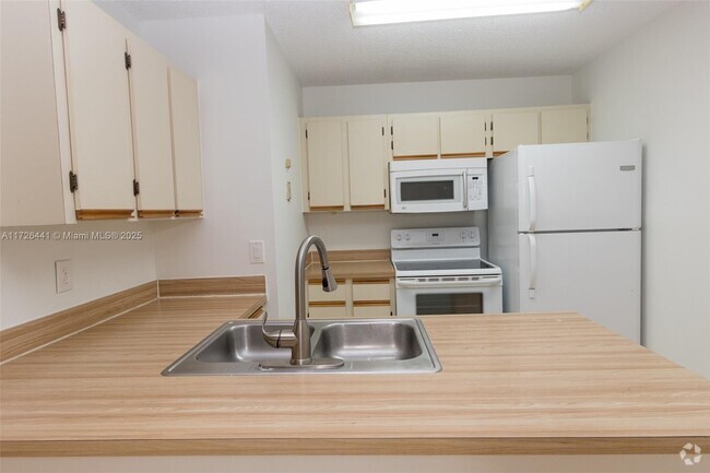 Building Photo - 18328 NW 68th Ave Unit P Rental