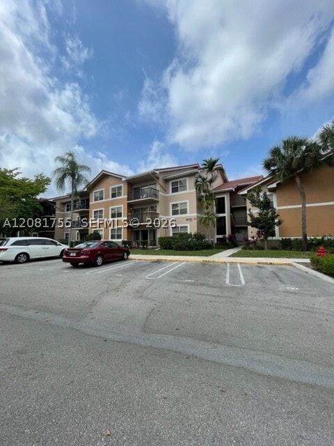 Building Photo - 8721 Wiles Rd Unit 208