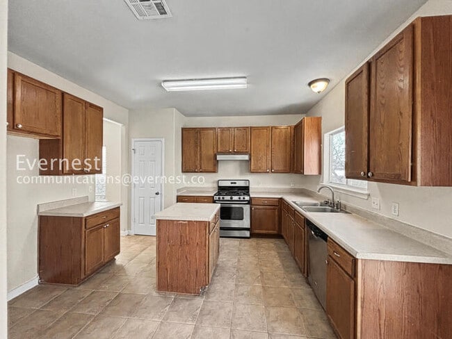 Photo - Charming 4-Bedroom Haven with Fireplace and Serene Outdoor Living / Pet-Friendly / Available Now!