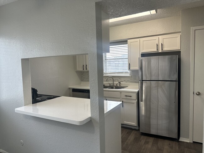 Chef Kitchen Open to Dining Area and Living Room - City West Apartments